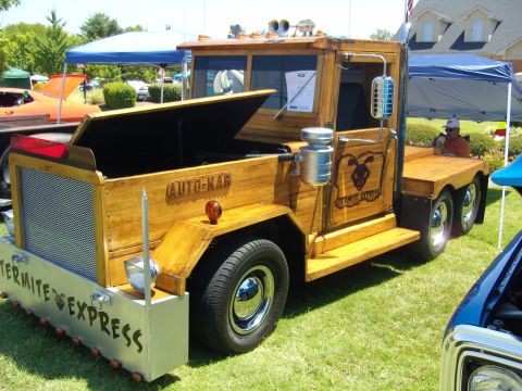 2007 Ford Mustang - Custom wooden truck named 'Termite Express' displayed at an outdoor event.