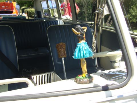2007 Ford Mustang - Vintage van interior features a hula dancer and tiki shift knob, with blue seats visible.