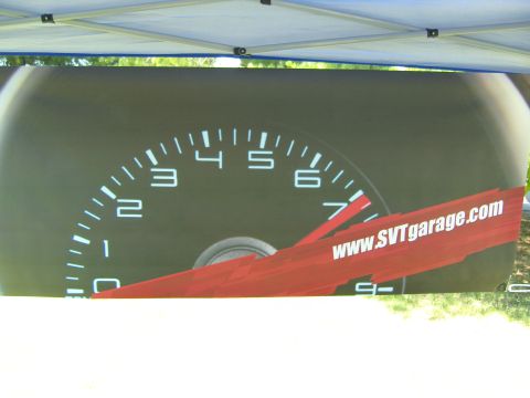 2007 Ford Mustang - A banner displays a vehicle's tachometer and a website address.