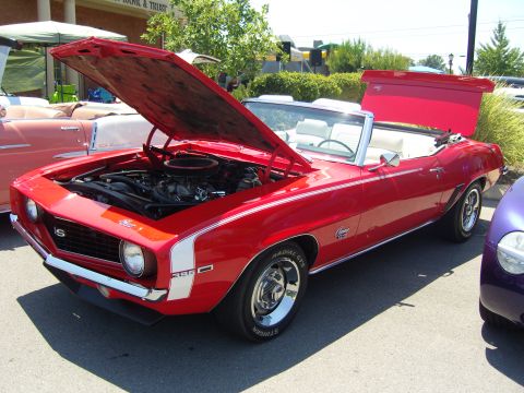 2007 Ford Mustang - Red 1969 Camaro SS convertible at a car show, hood and trunk open.