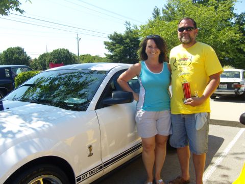 2007 Ford Mustang - A couple poses with their award-winning Ford Mustang GT500 at an outdoor car show.