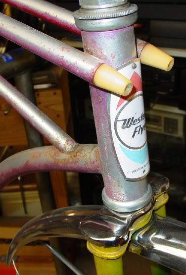 1953 Ford Mainline - Detail of a vintage bicycle frame, showing the head tube and handlebars with a Western Flyer decal.