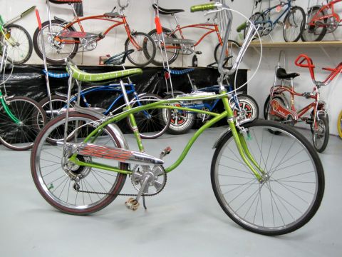 1953 Ford Mainline - Multiple vintage bicycles are displayed in a collection, with a green cruiser in the foreground.