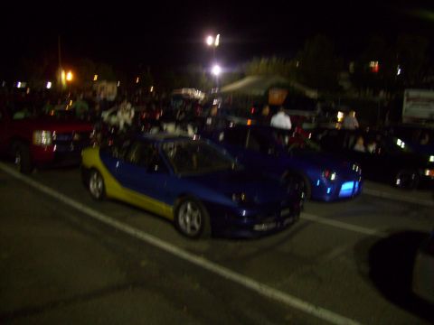 1995 Ford Probe - A two-tone 1995 Ford Probe is seen at an outdoor gathering at night.