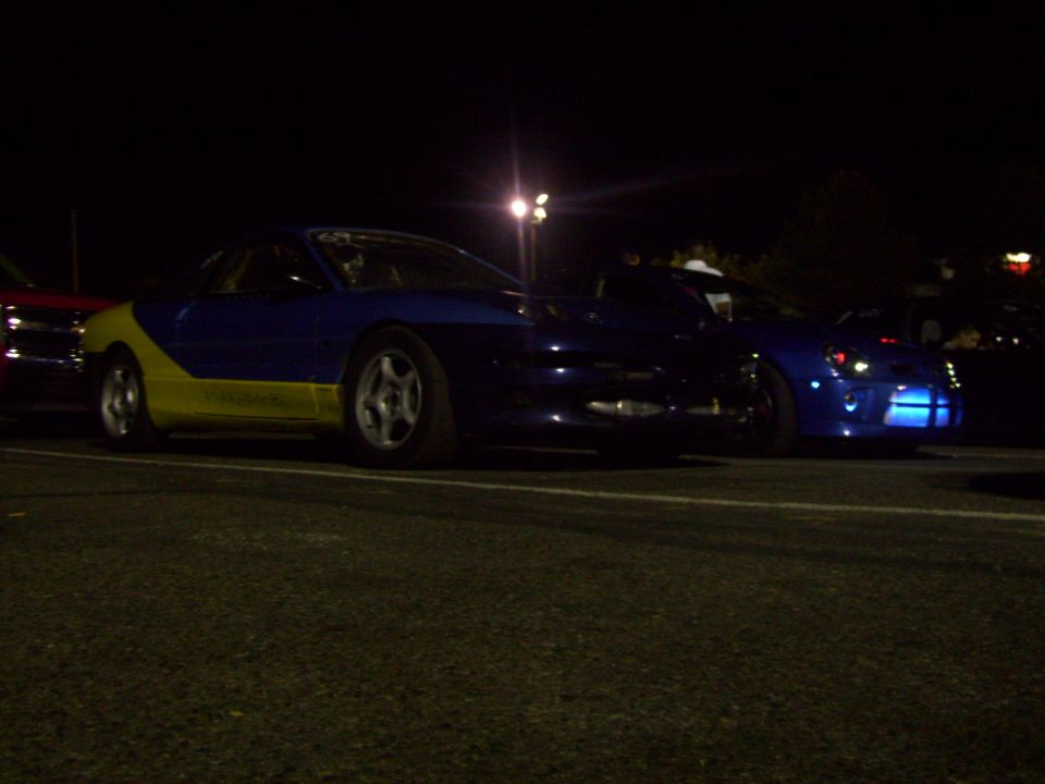 Blue and yellow sports car, 3/4 front view