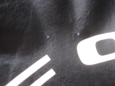 1993 Ford Bronco - A partial white logo is visible on a black surface, with a website address at the bottom.