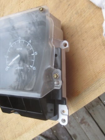 1993 Ford Bronco - A close-up view of a vehicle's gauge cluster, showing the tachometer and speedometer dials.