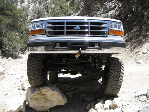 1996 Ford Bronco - Front view of a 1996 Ford Bronco navigating a rocky trail.