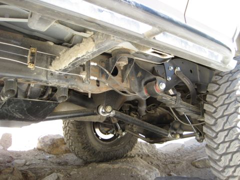 1996 Ford Bronco - Undercarriage view of a 1996 Ford Bronco, highlighting its suspension and off-road tires.