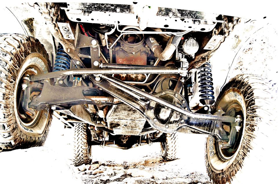 Undercarriage of a 1996 Ford Bronco showing suspension and drivetrain