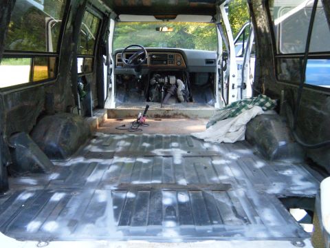 1988 Ford E350 - Interior view of a 1988 Ford E350 van with the flooring removed for restoration.