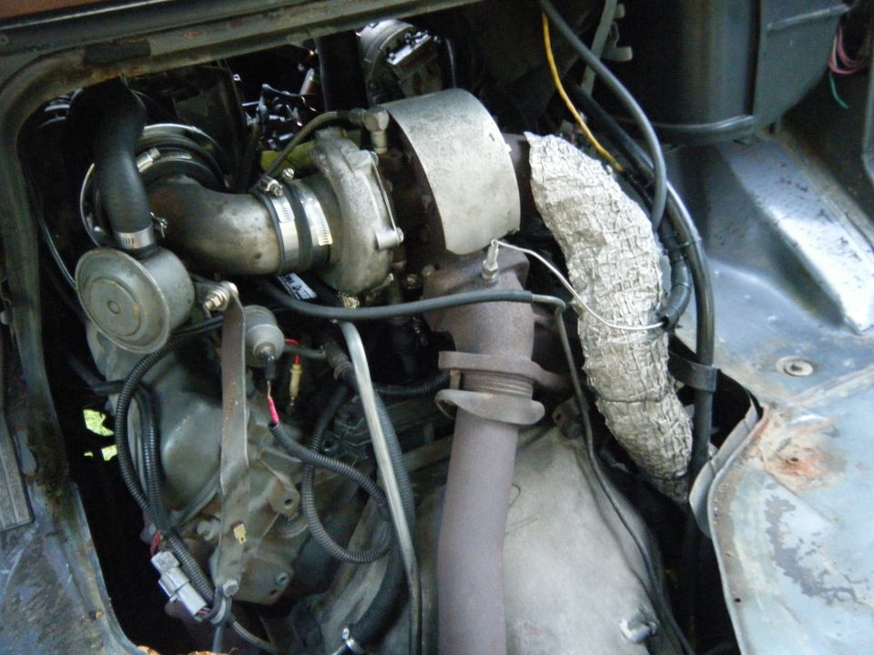 Close-up of a diesel engine with a turbocharger and exhaust manifold