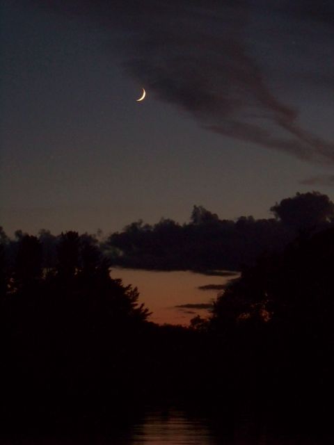 1996 Ford F-150 - A crescent moon hangs in the dusky sky above dark trees and a reflective body of water.