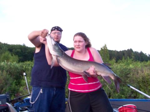 1996 Ford F-150 - A couple proudly displays their impressive catch from a day of fishing on the water.