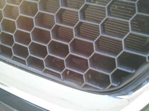 2008 Subaru Legacy - The honeycomb grille and chrome trim are characteristic of a 2008 Subaru Legacy.
