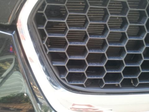 2008 Subaru Legacy - The hexagonal pattern of the vehicle's front grille is visible, with a chrome accent surrounding it.