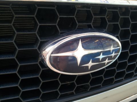 2008 Subaru Legacy - The Subaru emblem is centered on a black hexagonal grille.