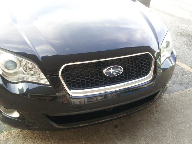 Black 2008 Subaru Legacy grille with chrome trim and emblem