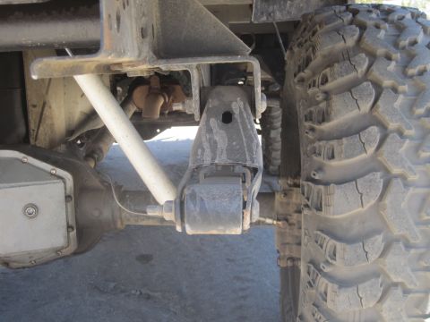 1989 Ford Bronco - Undercarriage view showing suspension and drivetrain parts of a vehicle.