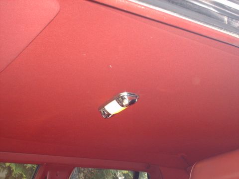 1991 Mercury Grand Marquis - The interior dome light is visible against the red headliner.