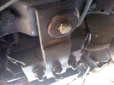 1964 Ford Ranchero - Undercarriage view of suspension and frame components, likely part of a vehicle's drivetrain.