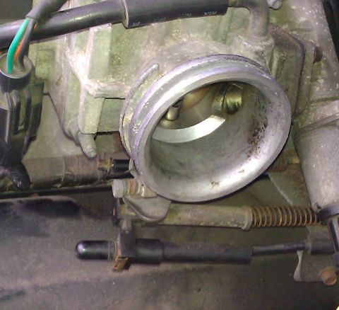 1991 Mercury Grand Marquis - Throttle body assembly showing internal components and linkage mechanism.