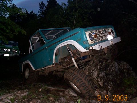 1977 Ford Bronco - This 1977 Ford Bronco is navigating a rocky trail at dusk, with another Bronco in the background.