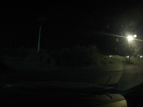 2003 Ford Taurus - Nighttime drive through a dimly lit area, with the car's interior visible in the foreground.