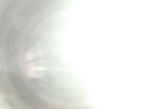 2003 Ford Taurus - Interior view of a car, obscured by bright light and dust particles.