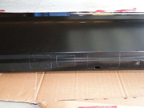 1978 Ford Bronco - A black metal panel with tape markings is shown, resting on a cardboard surface.
