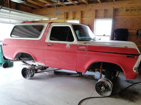 1978 Ford Bronco - This 1978 Ford Bronco is in a garage, lifted on stands for restoration work.