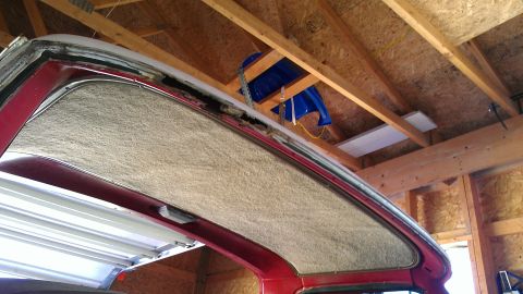 1978 Ford Bronco - The headliner and surrounding trim of a vehicle are visible, with exposed insulation and framing overhead.