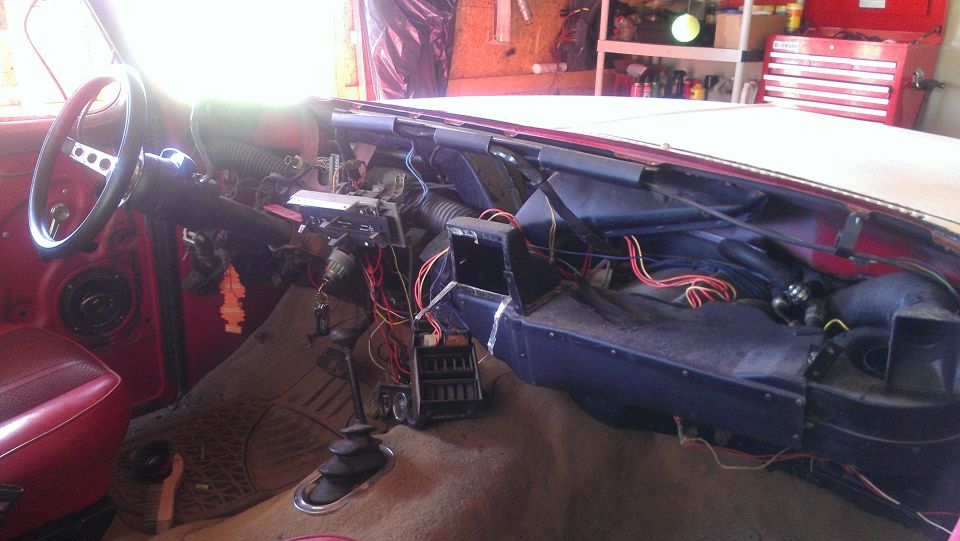 1978 Ford Bronco interior with dashboard disassembled, showing wires and vents