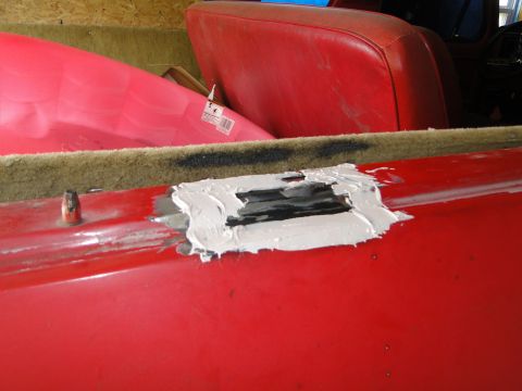 1978 Ford Bronco - Body panel repair in progress on a red vehicle interior.