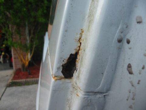1992 Ford Bronco - b-pillar passenger side right by the door jamb. You can see where the water coming in from the cracked rain gutter has caused it to rust fr…