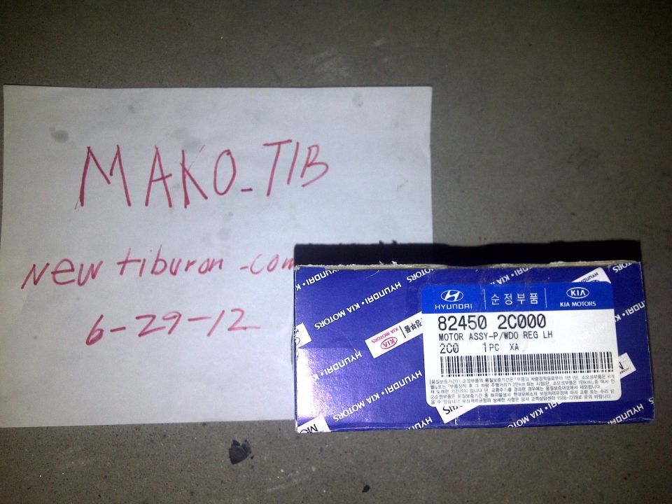 Box for a Hyundai/Kia motor assembly part, with handwritten notes on paper