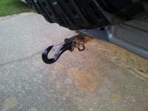1986 Ford Bronco - Close-up of a tow hitch receiver and hook, attached to the rear of a vehicle.