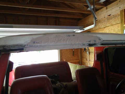 1978 Ford Bronco - Interior view of a red SUV, showing bodywork repairs on the roof panel.