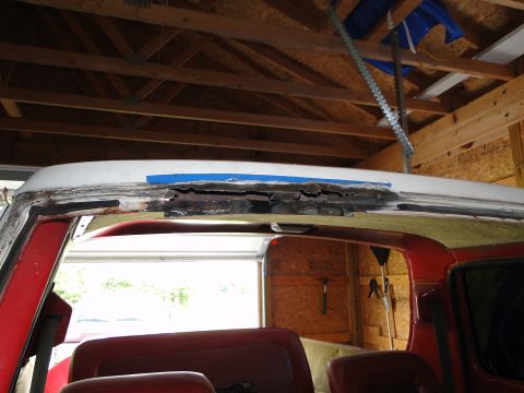 1978 Ford Bronco - The roof of a 1978 Ford Bronco shows significant rust and repair work.