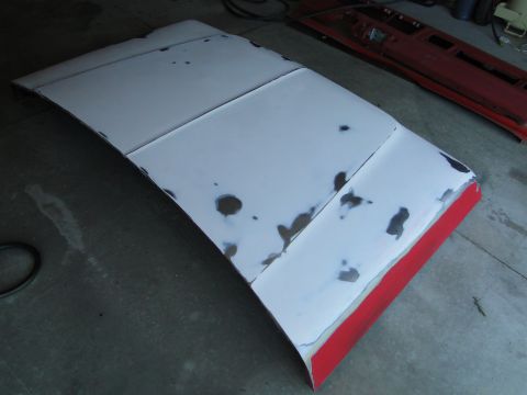 1978 Ford Bronco - A car hood and door are shown, both in need of repair and painting.