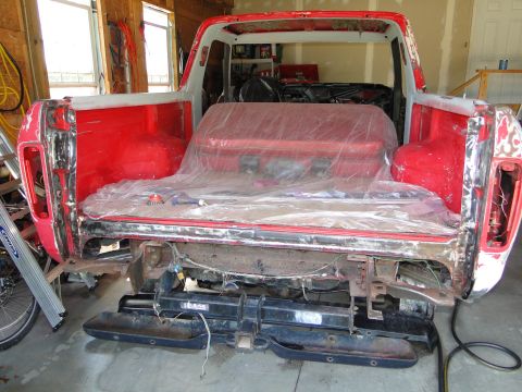 1978 Ford Bronco - This 1978 Ford Bronco is in a workshop, showing its rear end during restoration work.