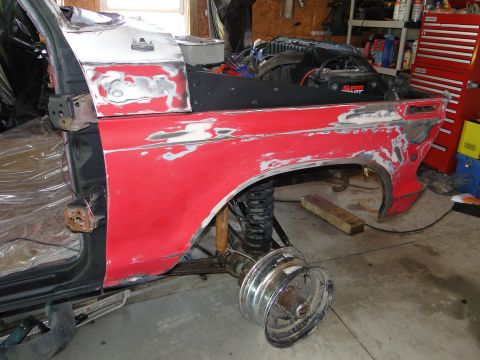 1978 Ford Bronco - This vehicle is undergoing bodywork, with parts removed and primer applied to the red panels.