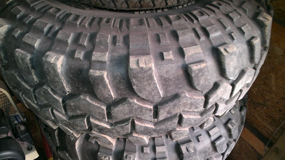Close-up of a stack of aggressive off-road tires