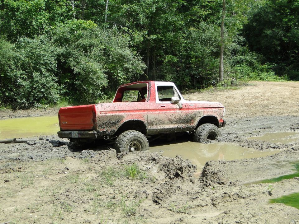 1978 Ford Bronco stuck in mud, side view