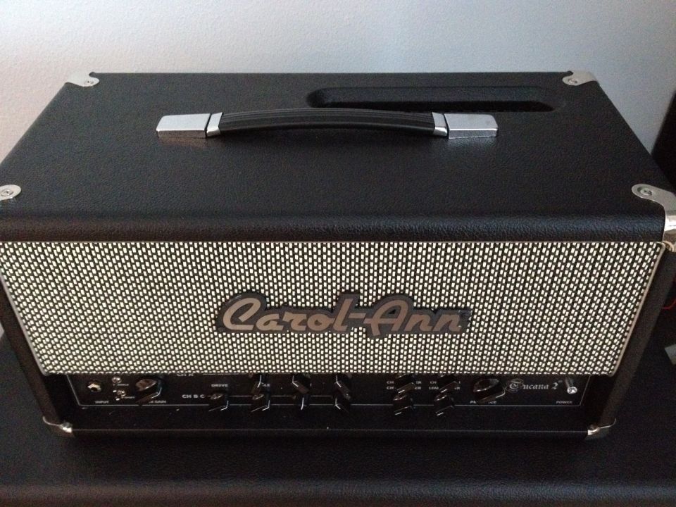 Black audio amplifier with 'Carol-Ann' logo and control knobs