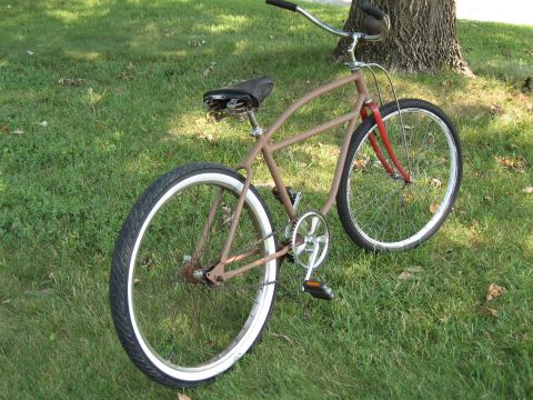 1994 Ford Bronco - A custom cruiser bicycle with a brown frame and red front fork sits on a grassy lawn.