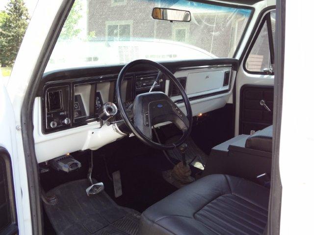 1978 Ford Bronco interior showing dashboard, steering wheel, seats, and floor mats