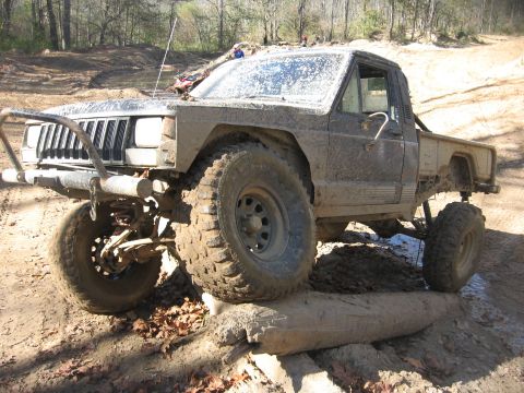 1987 Jeep Comanche - This heavily modified Jeep pickup truck navigates an off-road obstacle course.