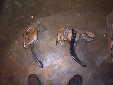 1991 Ford LTD Crown Victoria - Comparison of two brake and clutch pedal assemblies, likely for a Ford vehicle.