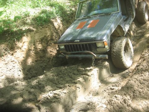 1987 Jeep Comanche - Jeep Comanche stuck in mud on an off-road trail.